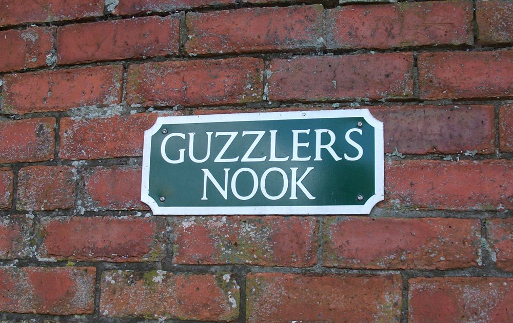 Photograph of "Guzzler's Nook" sign